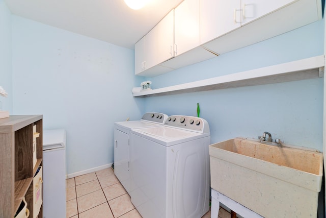 16-1381 Pohaku Cir, Keaau, HI 96749 - laundry room with cabinet space, washing machine and dryer, light tile patterned flooring, and baseboards