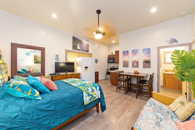 16-1381 Pohaku Cir, Keaau, HI 96749 - bedroom with white refrigerator with ice dispenser, light wood-type flooring, recessed lighting, ensuite bathroom, and ceiling fan