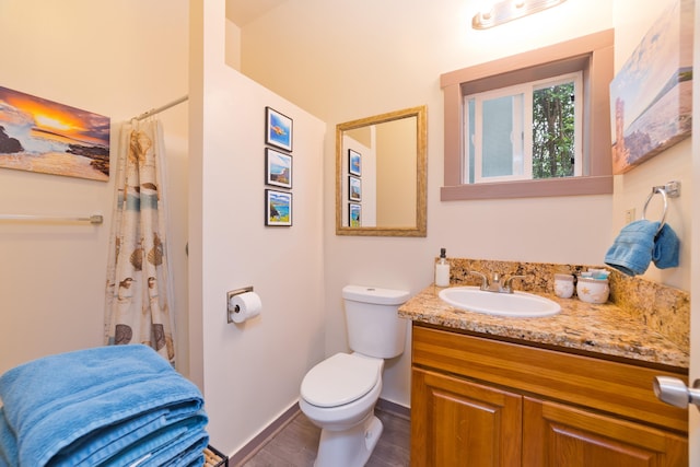 16-1381 Pohaku Cir, Keaau, HI 96749 - bathroom with vanity, toilet, wood finished floors, and baseboards