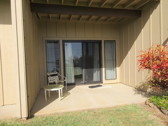 4460 Nehe Rd Unit 118, Lihue, HI 96766 - view of exterior entry featuring board and batten siding and a patio area