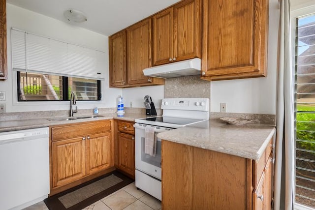 4460 Nehe Rd Unit 118, Lihue, HI 96766 - kitchen featuring under cabinet range hood, white appliances, a sink, and plenty of natural light