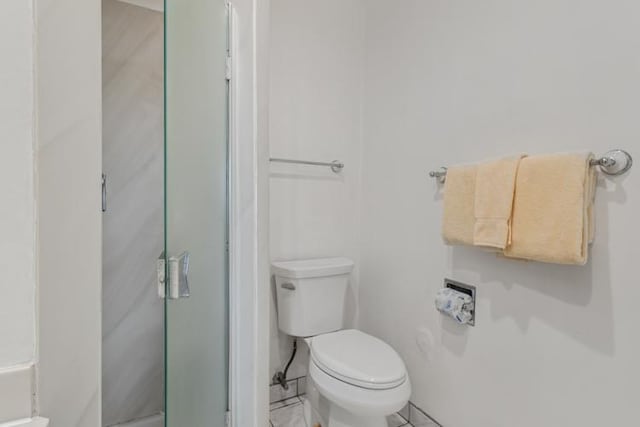 4460 Nehe Rd Unit 118, Lihue, HI 96766 - bathroom with a stall shower, tile patterned floors, and toilet