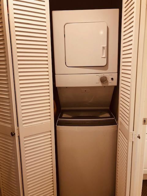 78-7054 Kamehameha Iii Rd Unit 1203, Kailua-Kona, HI 96740 - washroom with stacked washer / dryer