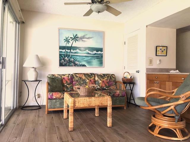 78-7054 Kamehameha Iii Rd Unit 1203, Kailua-Kona, HI 96740 - living area featuring wood finished floors and a ceiling fan