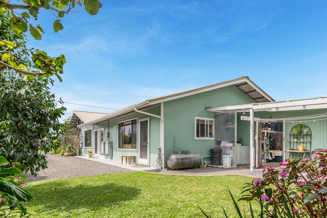64-5270 Hoohoa St, Kamuela, HI 96743 - back of property featuring a yard and a sunroom