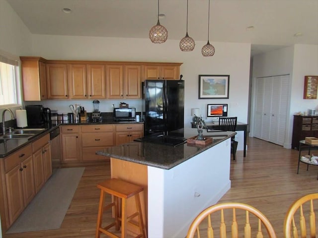 88-1978 Milolii Rd, Captain Cook, HI 96704 - kitchen with black appliances, a sink, light wood-style flooring, and a kitchen island
