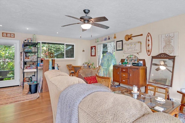 12-4266 Ocean View Pkwy, Pahoa, HI 96778 - living room featuring ceiling fan, light wood finished floors, and a textured ceiling