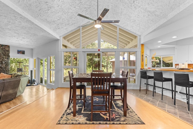 15-1913 Beach Rd, Keaau, HI 96749 - dining area with a textured ceiling, lofted ceiling, ceiling fan, and wood finished floors