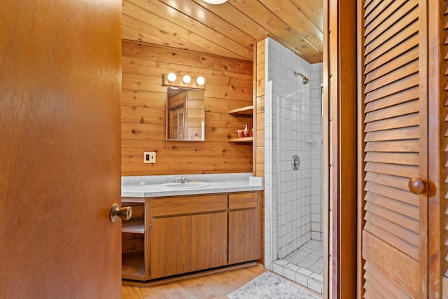 15-1913 Beach Rd, Keaau, HI 96749 - full bathroom featuring a shower stall, vanity, wood finished floors, and wood walls