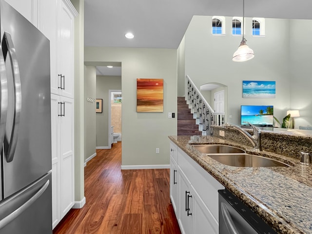 68-1125 Kaniku Dr Unit 1601, Kamuela, HI 96743 - kitchen featuring stainless steel appliances, a sink, dark wood finished floors, stone countertops, and white cabinets