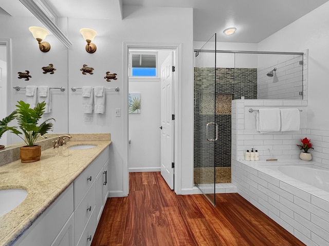 68-1125 Kaniku Dr Unit 1601, Kamuela, HI 96743 - full bathroom with a stall shower, a garden tub, double vanity, wood finished floors, and baseboards