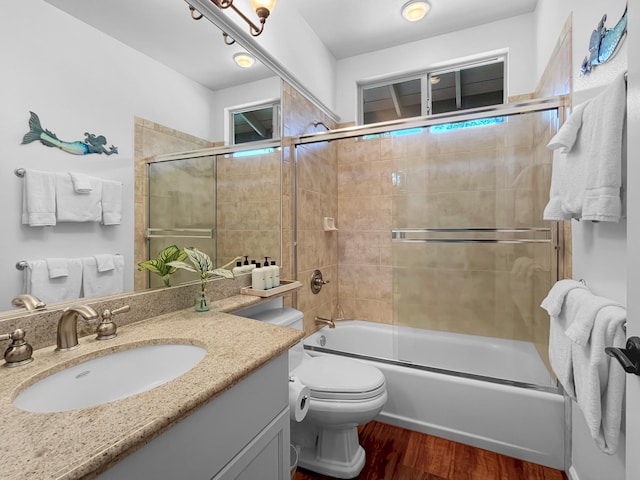 68-1125 Kaniku Dr Unit 1601, Kamuela, HI 96743 - full bath featuring vanity, toilet, wood finished floors, and combined bath / shower with glass door