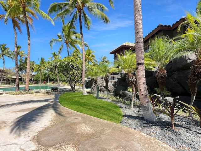 68-1125 Kaniku Dr Unit 1601, Kamuela, HI 96743 - view of yard featuring an outdoor pool and a patio
