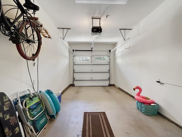 68-1125 Kaniku Dr Unit 1601, Kamuela, HI 96743 - garage with a garage door opener and baseboards
