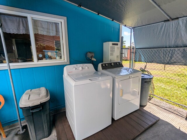 15-1468 23rd Ave, Keaau, HI 96749 - laundry area featuring washing machine and clothes dryer and wood finished floors