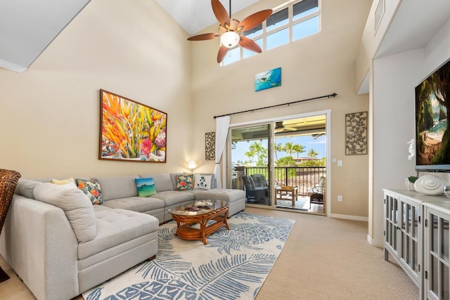 68-1122 Na Ala Hele Rd Unit H22, Kamuela, HI 96743 - living room with ceiling fan, carpet flooring, baseboards, a high ceiling, and healthy amount of natural light