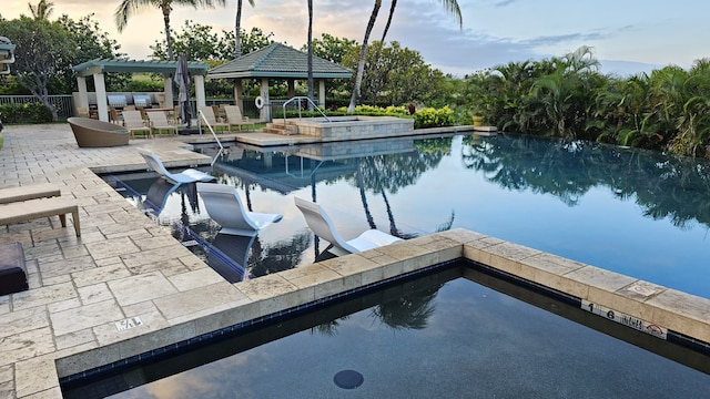 62-3600 Amaui Pl Unit 345, Waimea, HI 96743 - pool at dusk with a gazebo, a patio area, and a pool with connected hot tub
