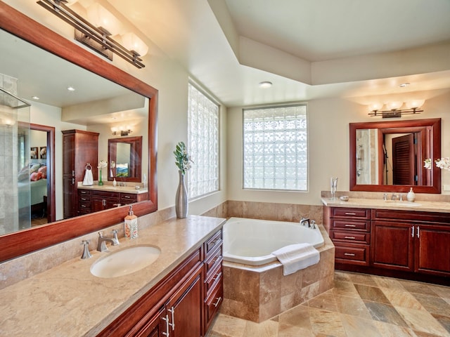 62-3600 Amaui Pl Unit 345, Waimea, HI 96743 - full bathroom with two vanities, a bath, and recessed lighting