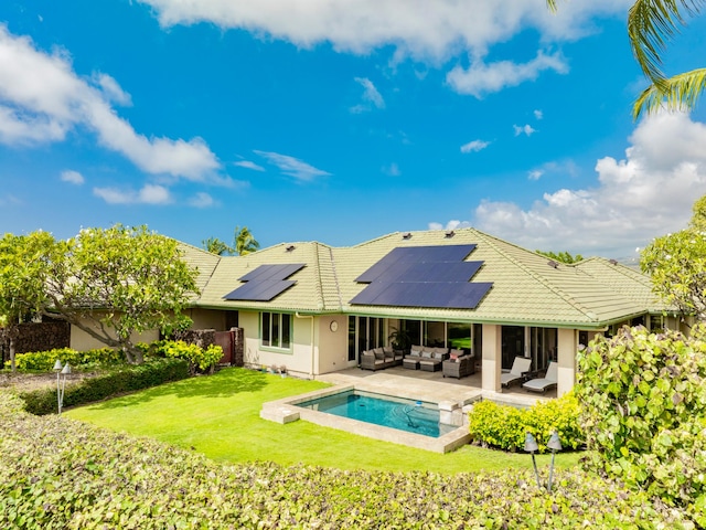 62-3600 Amaui Pl Unit 345, Waimea, HI 96743 - back of house with an outdoor hangout area, solar panels, stucco siding, and a tile roof