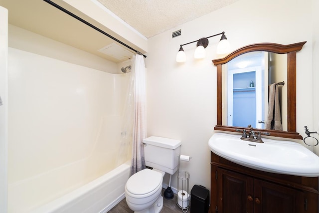 84 Pukihae St Unit 1106, Hilo, HI 96720 - bathroom with vanity, toilet, shower / tub combo, a textured ceiling, and wood finished floors