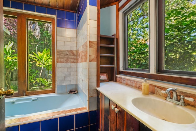 7315 Alealea Rd, Hanalei, HI 96714 - bathroom featuring a relaxing tiled tub, vanity, and wooden ceiling