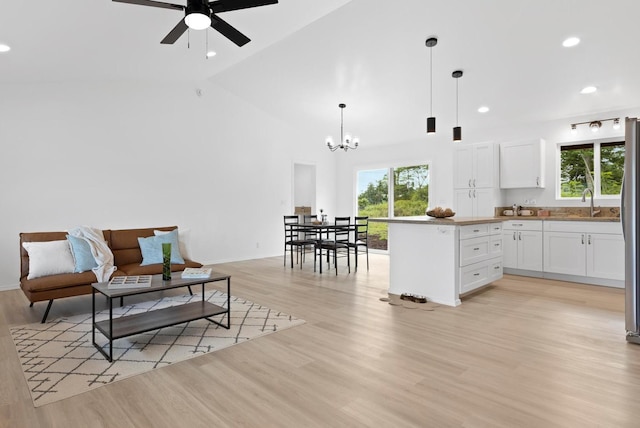 16-2072 Hapuu Dr, Pahoa, HI 96778 - kitchen featuring healthy amount of natural light, white cabinetry, a ceiling fan, light wood-style flooring, and recessed lighting