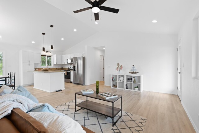 16-2072 Hapuu Dr, Pahoa, HI 96778 - living room featuring ceiling fan, light wood-style flooring, recessed lighting, baseboards, and high vaulted ceiling