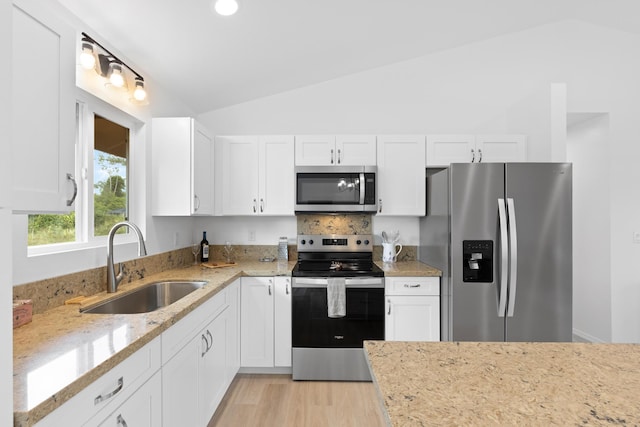 16-2072 Hapuu Dr, Pahoa, HI 96778 - kitchen with appliances with stainless steel finishes, a sink, lofted ceiling, light stone counters, and white cabinets