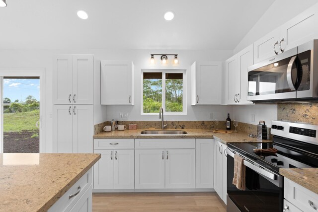 16-2072 Hapuu Dr, Pahoa, HI 96778 - kitchen featuring appliances with stainless steel finishes, a sink, white cabinets, light stone counters, and recessed lighting