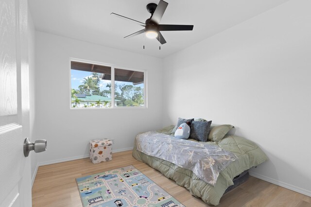 16-2072 Hapuu Dr, Pahoa, HI 96778 - bedroom with wood finished floors, baseboards, and ceiling fan