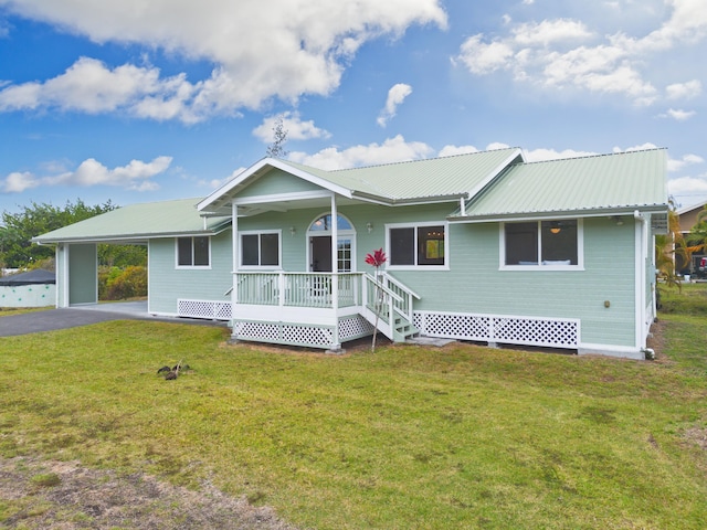 15-1505 2nd Ave, Keaau, HI 96749 - ranch-style home with covered porch, a carport, metal roof, a front yard, and asphalt driveway