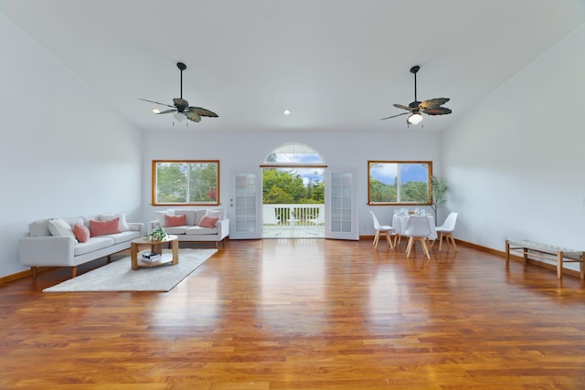 15-1505 2nd Ave, Keaau, HI 96749 - living area featuring a ceiling fan, wood finished floors, high vaulted ceiling, and baseboards