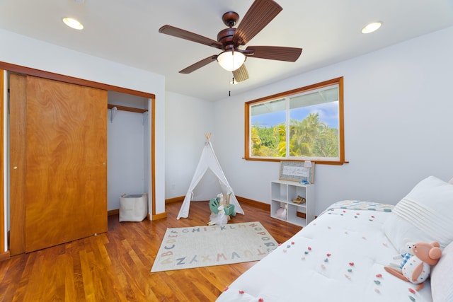15-1505 2nd Ave, Keaau, HI 96749 - bedroom with baseboards, wood finished floors, recessed lighting, ceiling fan, and a closet