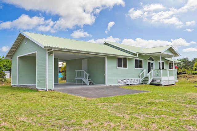 15-1505 2nd Ave, Keaau, HI 96749 - rear view of property featuring a lawn, metal roof, a porch, and a carport