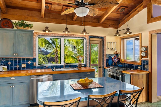 87-287 Kaohe Rd, Captain Cook, HI 96704 - kitchen with wooden ceiling with exposed beams, appliances with stainless steel finishes, wooden counters, a sink, and backsplash