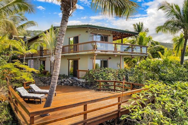87-287 Kaohe Rd, Captain Cook, HI 96704 - back of property featuring stucco siding, a balcony, and a deck