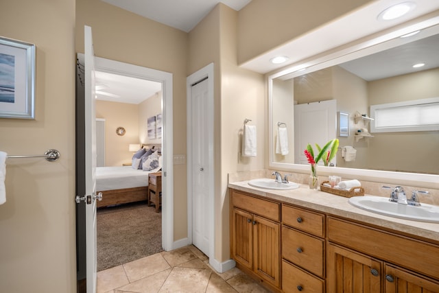 1831 Poipu Rd Unit 611, Koloa, HI 96756 - ensuite bathroom featuring double vanity, tile patterned floors, and baseboards