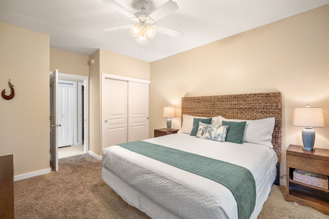 1831 Poipu Rd Unit 611, Koloa, HI 96756 - carpeted bedroom with a closet, baseboards, and a ceiling fan