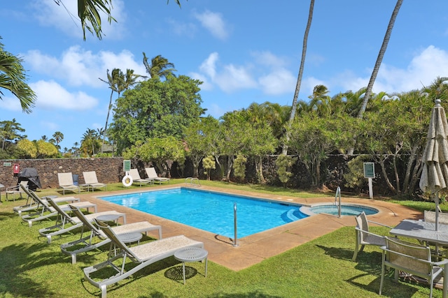 1831 Poipu Rd Unit 611, Koloa, HI 96756 - view of swimming pool featuring a pool with connected hot tub and a patio area