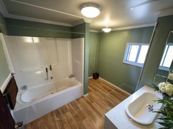 92-8305 Mamalahoa Hwy, Ocean View, HI 96737 - bathroom featuring ornamental molding, shower / washtub combination, wood finished floors, vanity, and baseboards