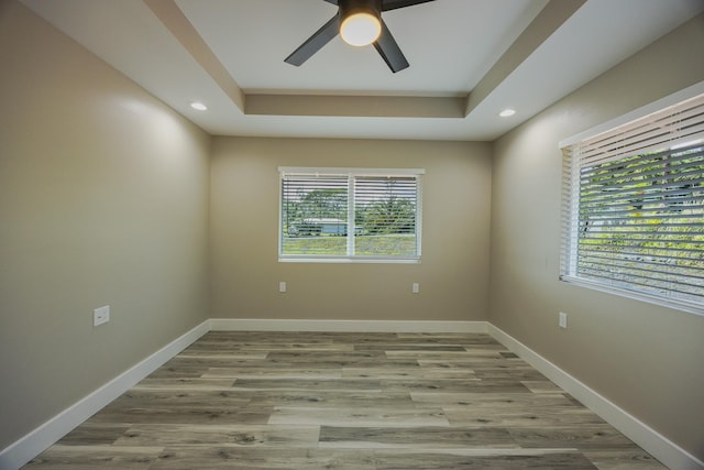 15-1779 14th Ave, Keaau, HI 96749 - empty room featuring a ceiling fan, a raised ceiling, wood finished floors, recessed lighting, and baseboards