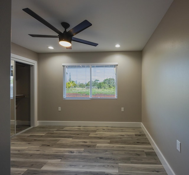 15-1779 14th Ave, Keaau, HI 96749 - empty room featuring a ceiling fan, recessed lighting, wood finished floors, and baseboards