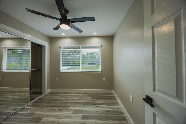 15-1779 14th Ave, Keaau, HI 96749 - unfurnished bedroom featuring multiple windows, wood finished floors, a closet, ceiling fan, and recessed lighting