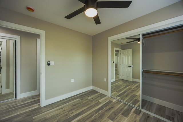 15-1779 14th Ave, Keaau, HI 96749 - unfurnished bedroom featuring wood finished floors, a closet, baseboards, and ceiling fan