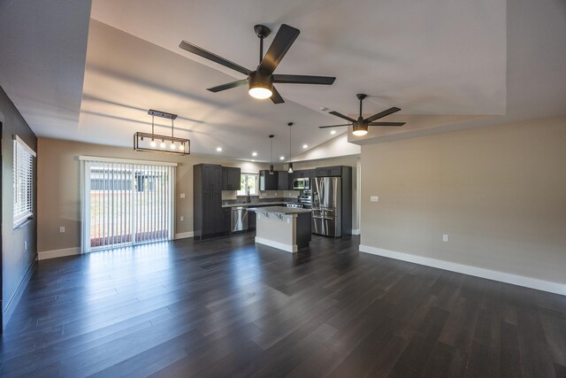 15-1785 14th Ave, Keaau, HI 96749 - unfurnished living room featuring ceiling fan, vaulted ceiling, baseboards, dark wood-style floors, and recessed lighting