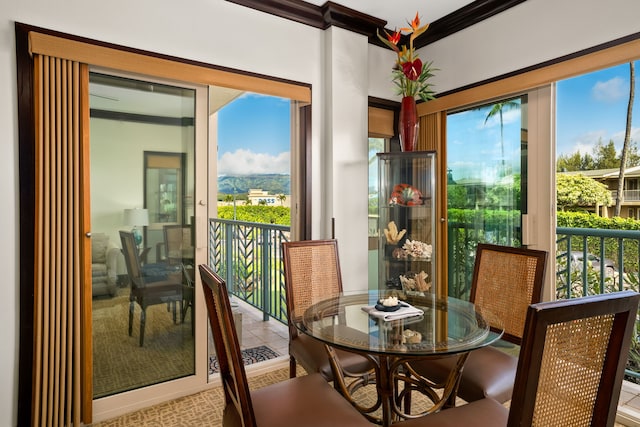4-820 Kuhio Hwy Unit C205, Kapaa, HI 96746 - dining room with healthy amount of natural light and crown molding