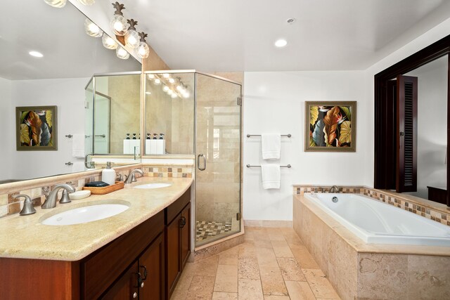 4-820 Kuhio Hwy Unit C205, Kapaa, HI 96746 - full bathroom with stone tile flooring, a garden tub, a shower stall, double vanity, and recessed lighting