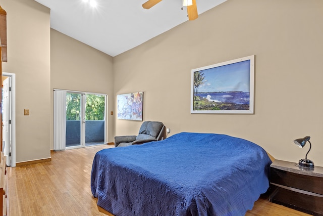 15-1023 Ala Heiau Rd, Keaau, HI 96749 - bedroom with access to outside, hardwood / wood-style floors, a towering ceiling, a ceiling fan, and baseboards