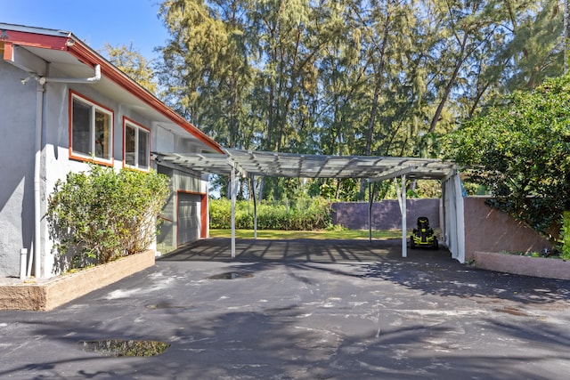 15-1023 Ala Heiau Rd, Keaau, HI 96749 - view of parking / parking lot featuring driveway, a carport, and a garage