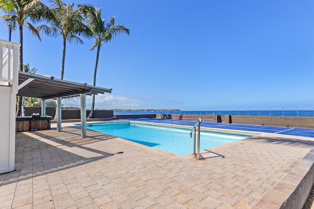 15-1023 Ala Heiau Rd, Keaau, HI 96749 - view of swimming pool featuring a patio, a fenced backyard, a hot tub, and a water view